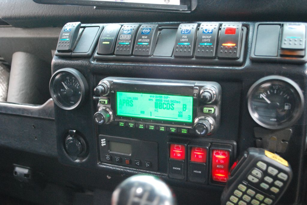 Centre dash showing Icom IC-2820 VHF/UHF D-STAR radio display, Carling switchgear, Blue Sea remote switches and Espar control panel